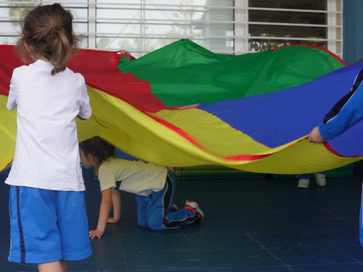 Children playing with a parachute